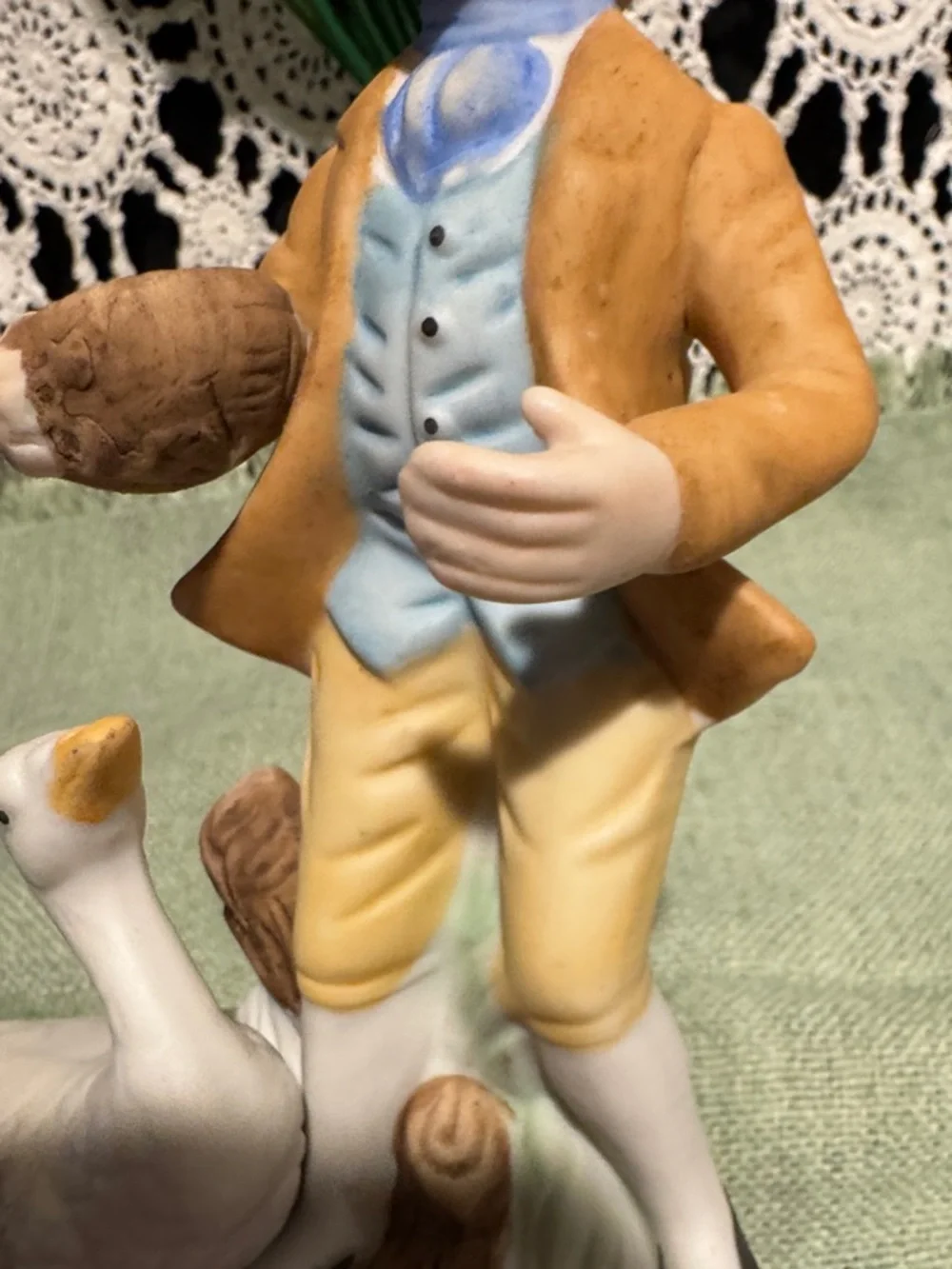 Boy Figurine with A Duck or Goose - White and Pastel Colors